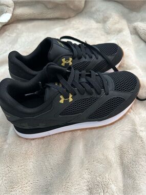 Under Armour Women’s Black Athletic Sneakers with Gold Logo